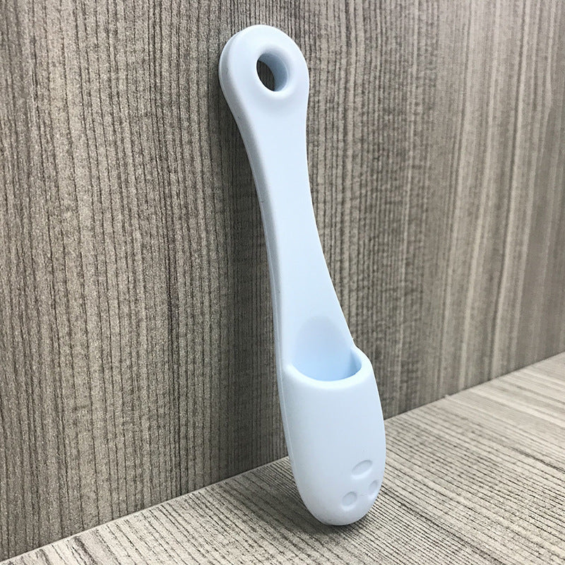 Face cleansing finger brush in light blue