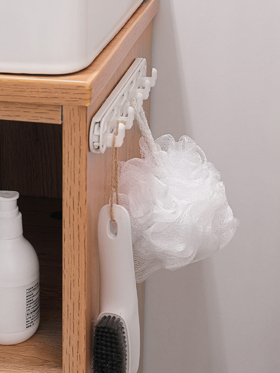 Sliding hooks for cups, utensils and towels under a kitchen cabinet