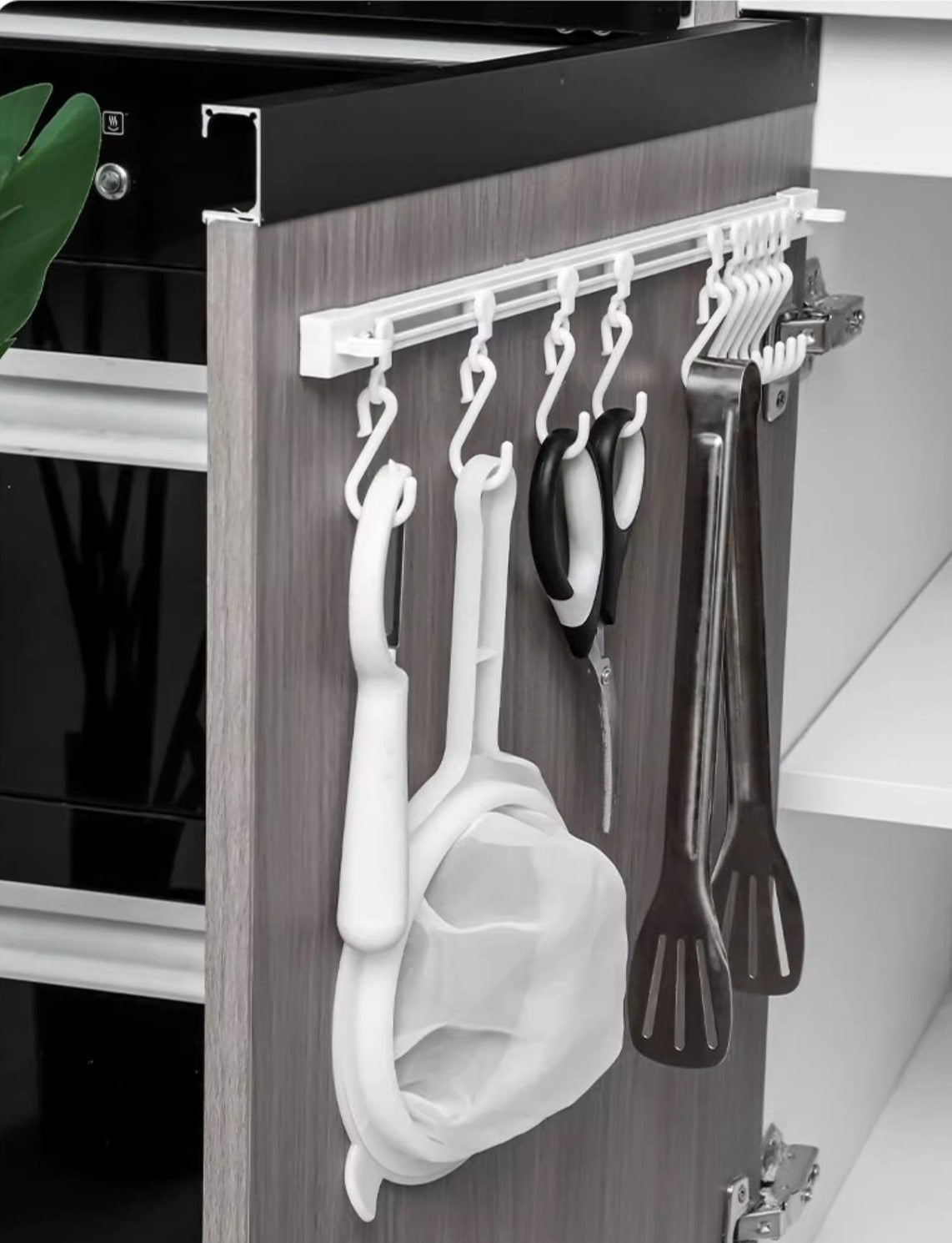 Kitchen utensil sliding hook rail