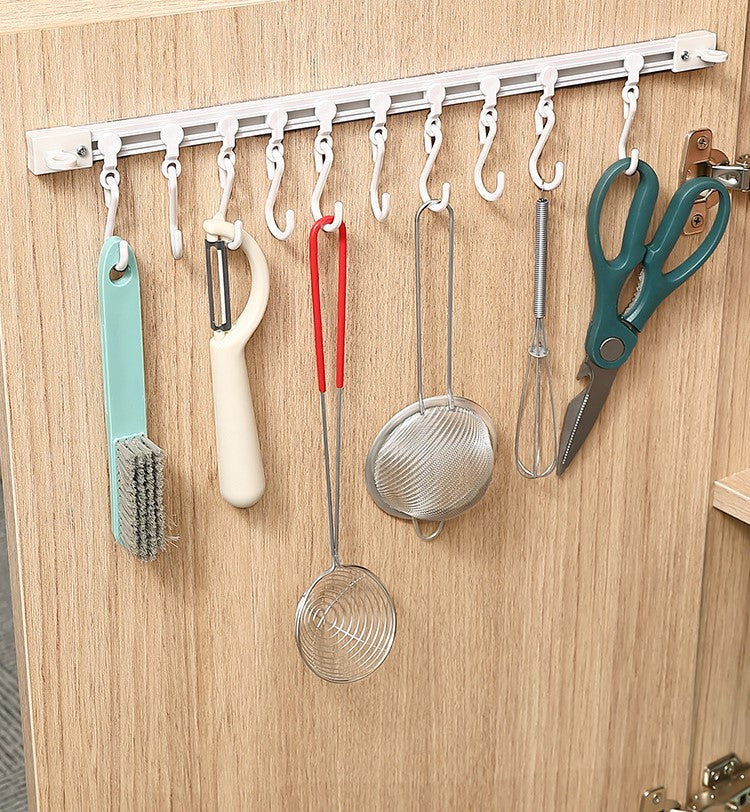 Sliding hook rail for wardrobes