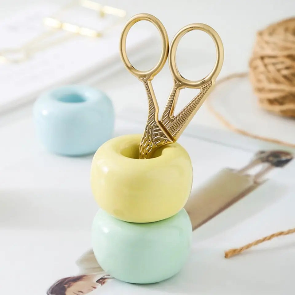 Small ceramic stand that holds brushes upright