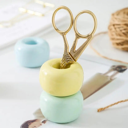 Small ceramic stand that holds brushes upright