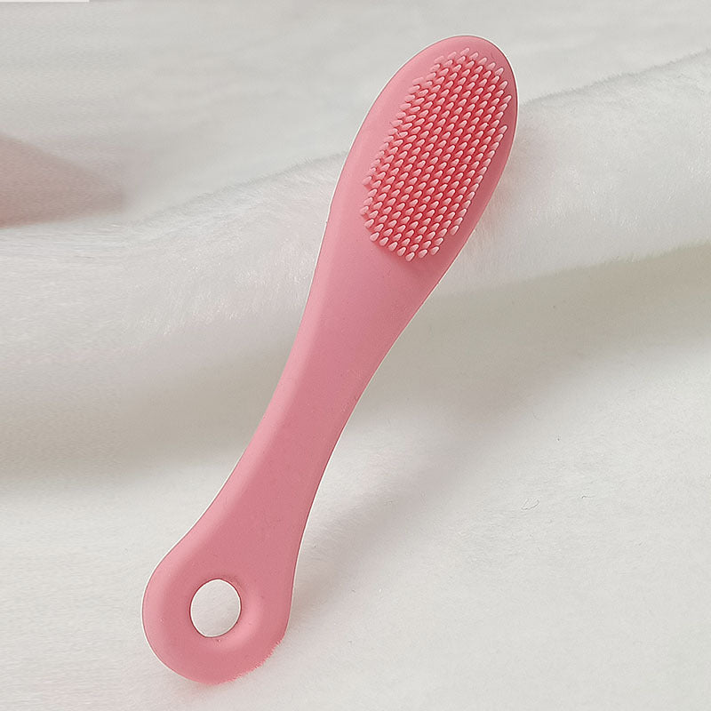 Face cleansing finger brush in dark pink