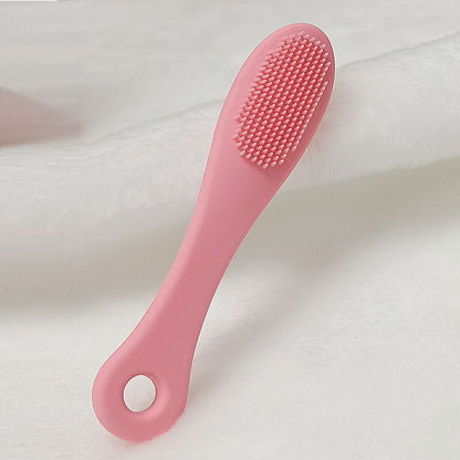 Face cleansing finger brush in dark pink