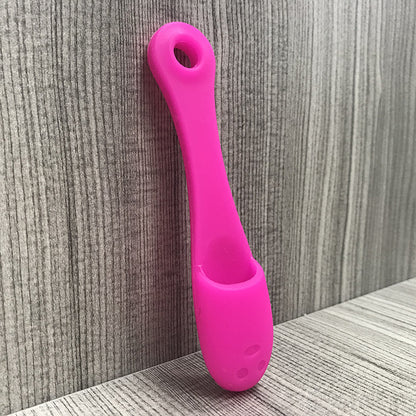 Face cleansing finger brush in fuchsia