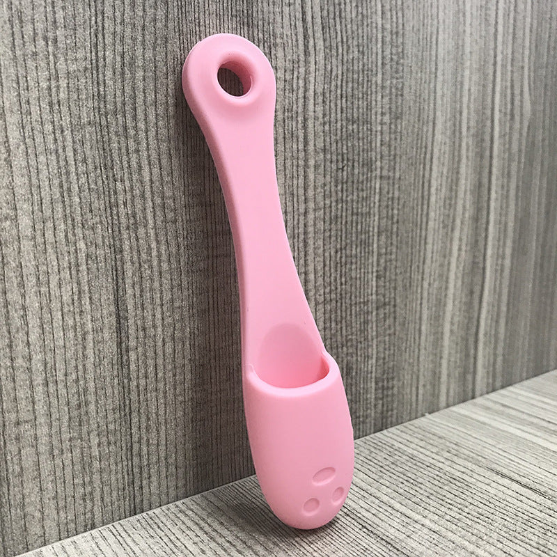 Face cleansing finger brush in light pink