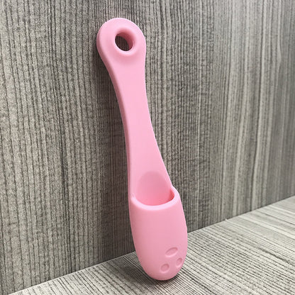 Face cleansing finger brush in light pink