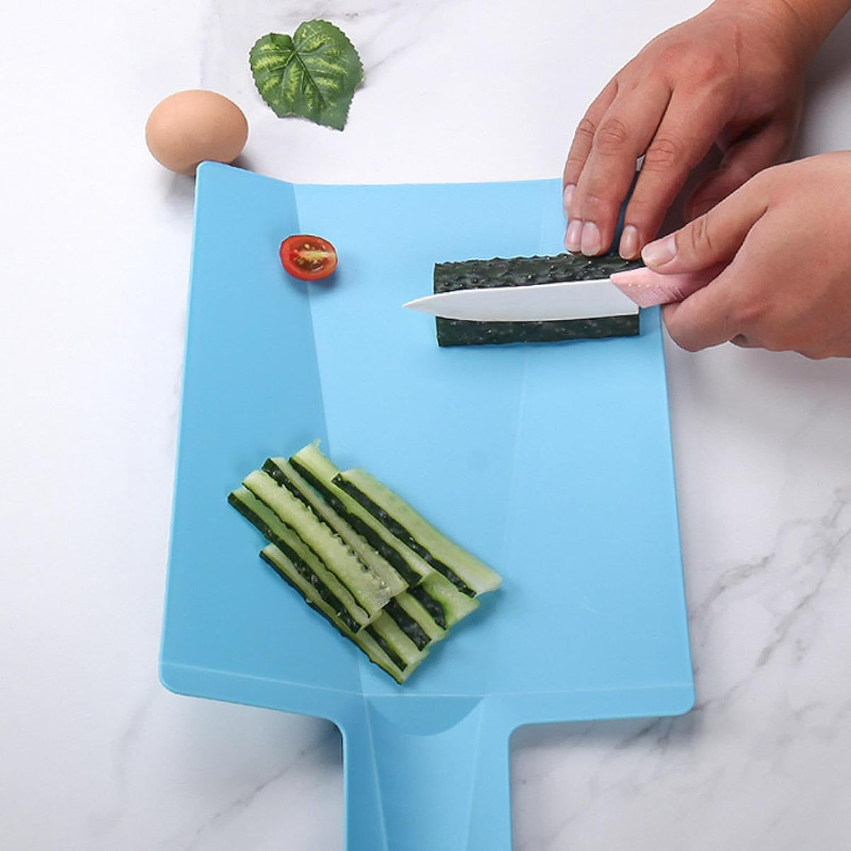Foldable cutting board for pouring chopped food straight into the pot
