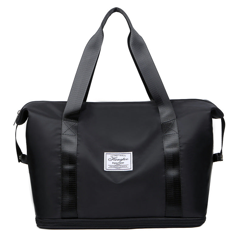Foldable large capacity duffel bag in black, water-resistant vegan leather
