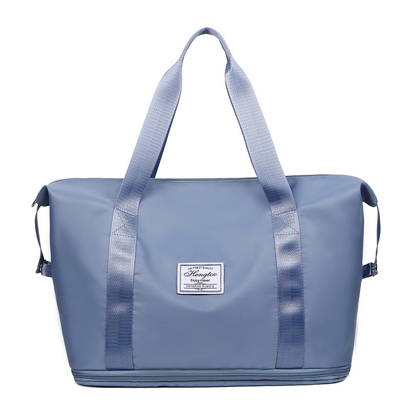 Foldable large capacity duffel bag in bluish grey, water-resistant vegan leather