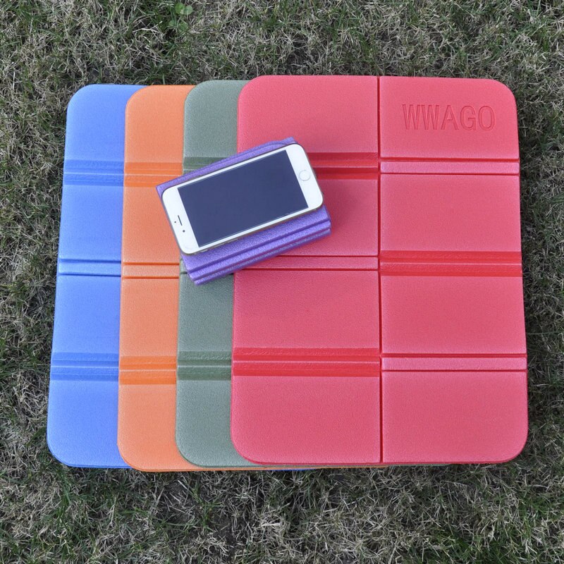 Portable folding seat cushion for stadiums and park benches