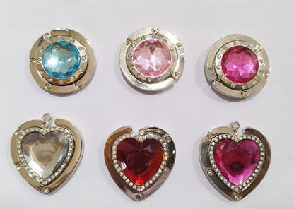 Foldable magnetic handbag holder in circle and heart designs