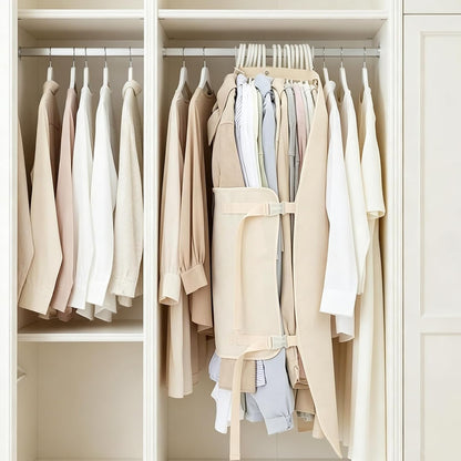 Hanging clothes compression organizer holding a bundle of clothes in a white closet