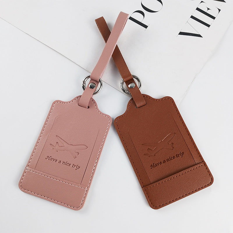 Leather luggage tag with privacy flap covering the ID card window