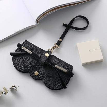 Portable sunglasses holder in black soft PU leather with metal snap button