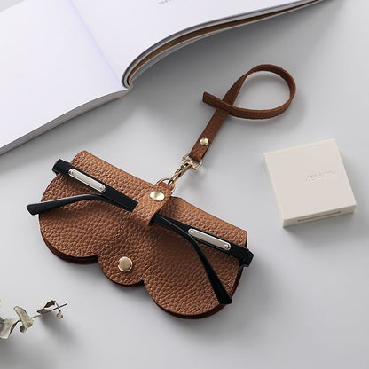 Portable sunglasses holder in brown soft PU leather with metal snap button