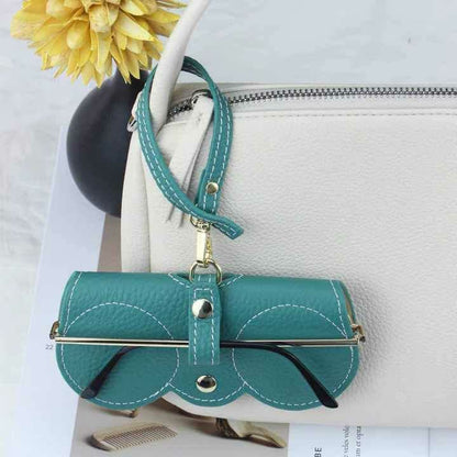 Portable sunglasses holder in turquoise soft PU leather with metal snap button