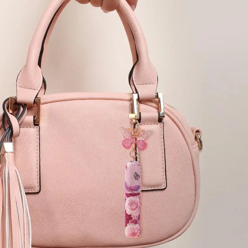 Refillable keychain perfume bottle with a secure screw-top seal
