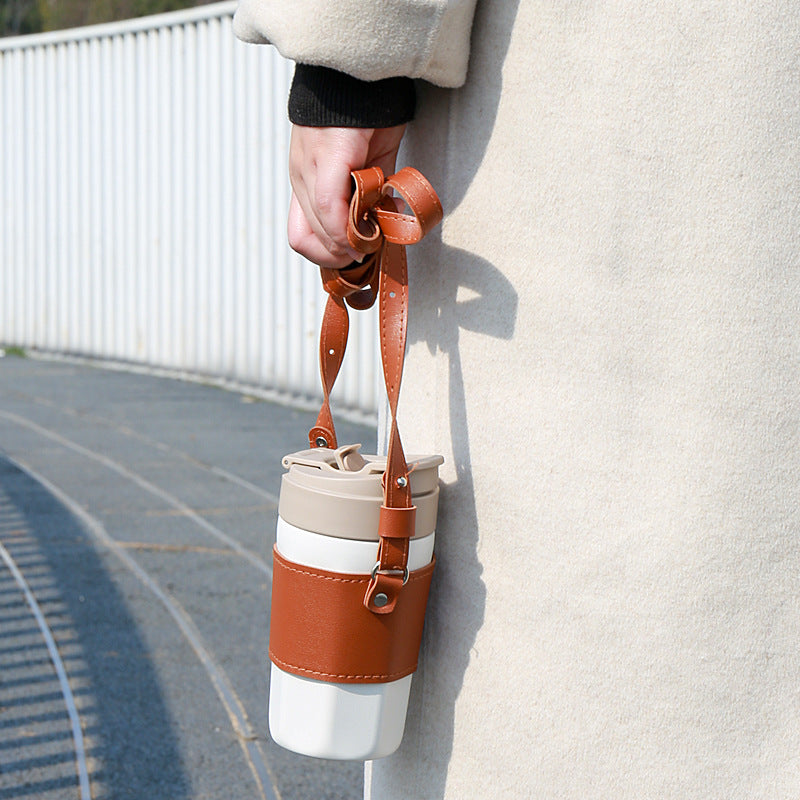 Hands-free coffee cup holder worn over the shoulder