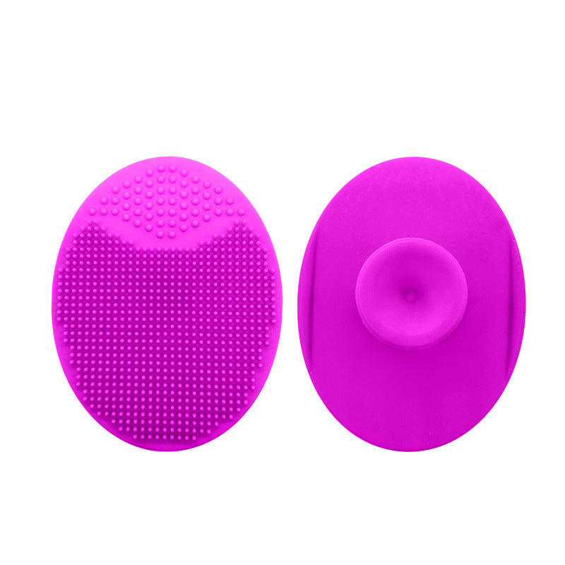 Silicone face scrubber in fuchsia