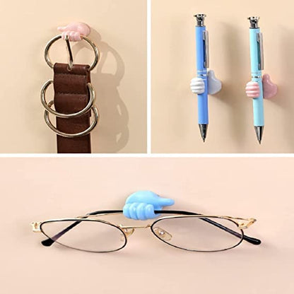 Self-adhesive thumb hook for toothbrushes and towels in the bathroom