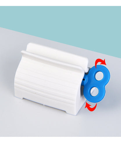 Rolling toothpaste squeezer in blue