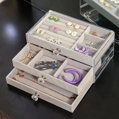 Waf Store Lebanon 3-drawer jewelry box in clear acrylic with soft grey velvet interior and crystal-style knobs.