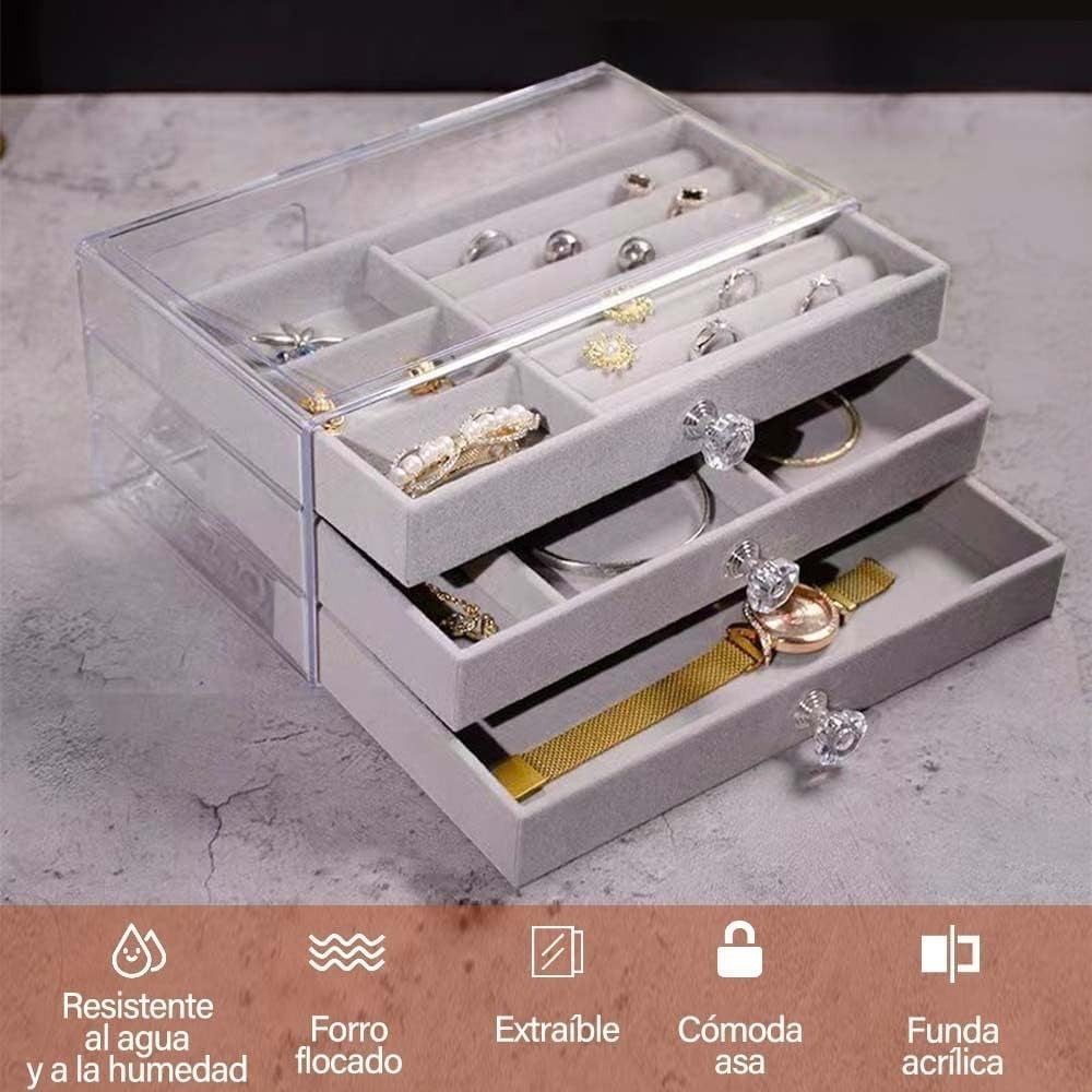 Waf Store Lebanon 3-drawer jewelry box in clear acrylic with soft grey velvet interior and crystal-style drawer knobs.