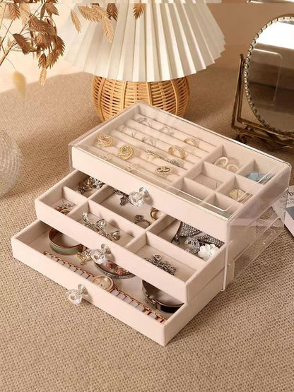 Waf Store Lebanon 3-drawer jewelry box with transparent acrylic exterior and soft beige velvet interior compartments.