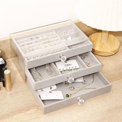 Waf Store Lebanon 3-drawer jewelry box with transparent acrylic exterior and soft grey velvet interior compartments.