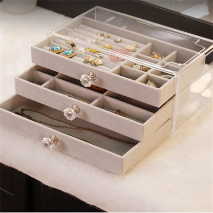 Waf Store Lebanon 3-drawer jewelry box with transparent acrylic exterior and soft grey velvet interior compartments.