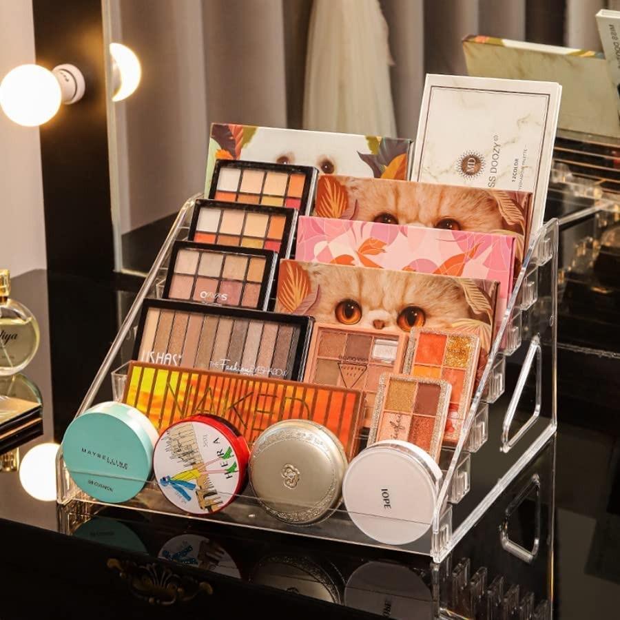 Waf Store Lebanon transparent acrylic tiered makeup organizer displaying eyeshadow palettes and compact powders