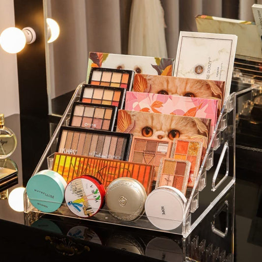 Waf Store Lebanon transparent acrylic tiered makeup organizer displaying eyeshadow palettes and compact powders