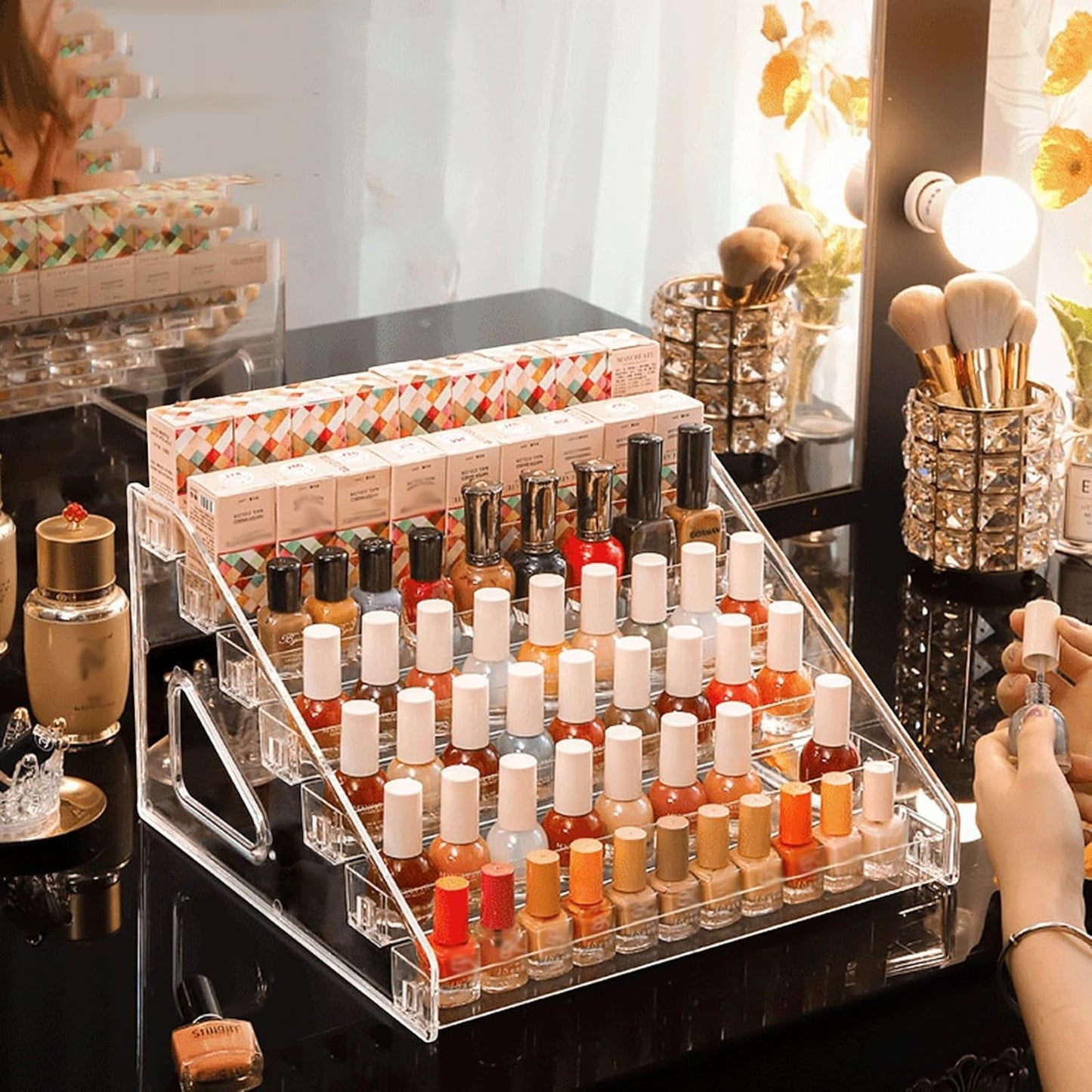 Waf Store Lebanon clear acrylic tiered nail polish display stand holding multiple bottles on a vanity table