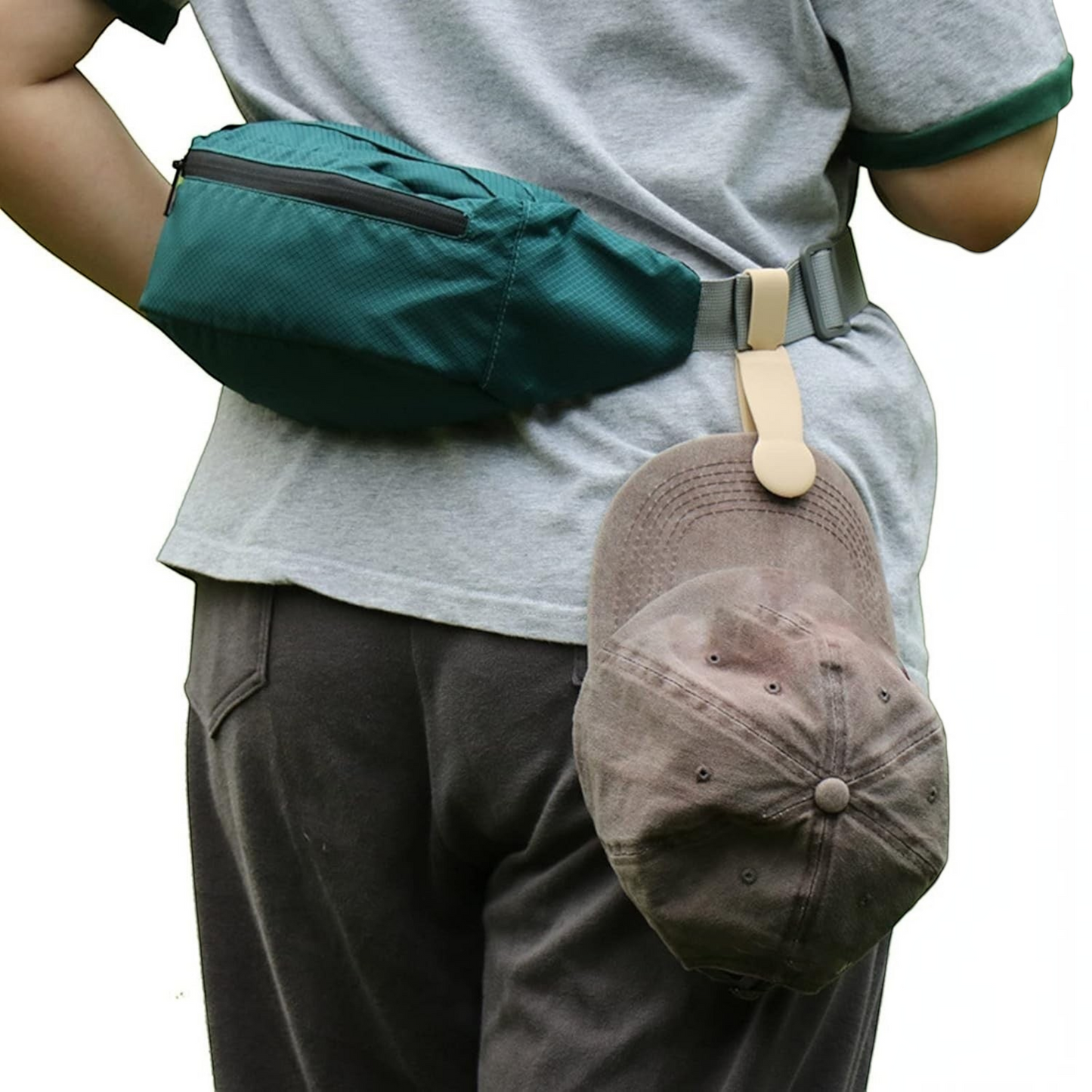 Waf Store Lebanon beige magnetic hat clip attached to a belt loop holding a brown baseball cap