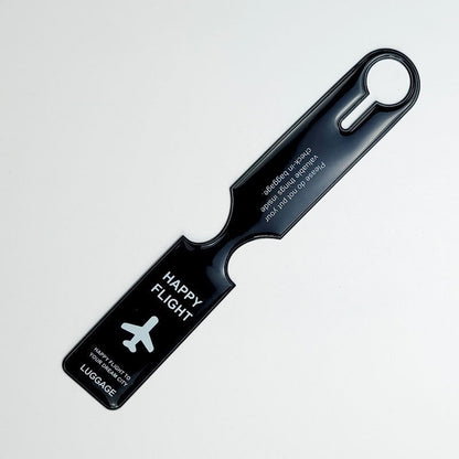 Waf Store Lebanon black flexible PVC luggage tag with Happy Flight airplane graphic and travel safety text