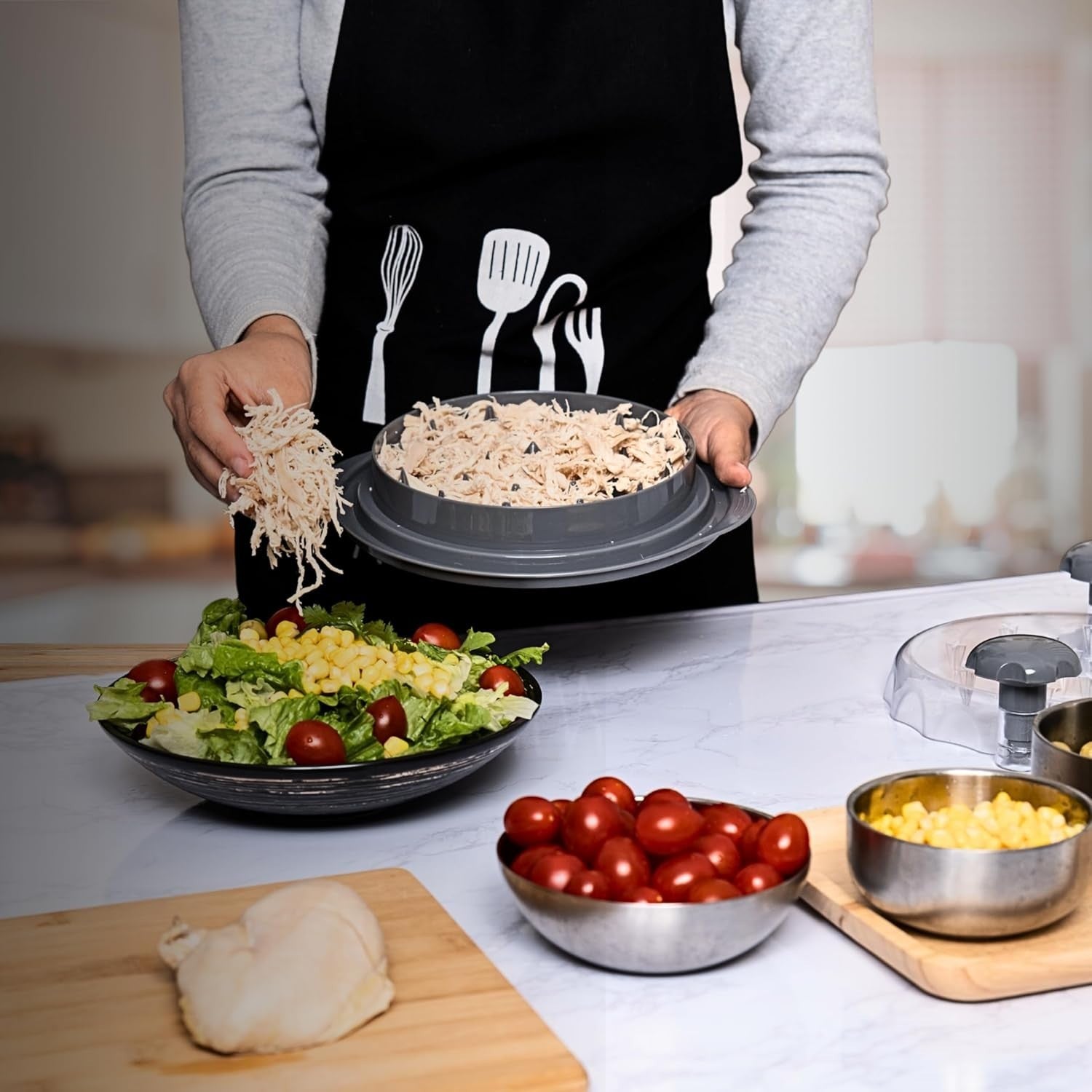Waf Store Lebanon chicken shredder tool being used to add shredded meat to a fresh salad in a kitchen setting