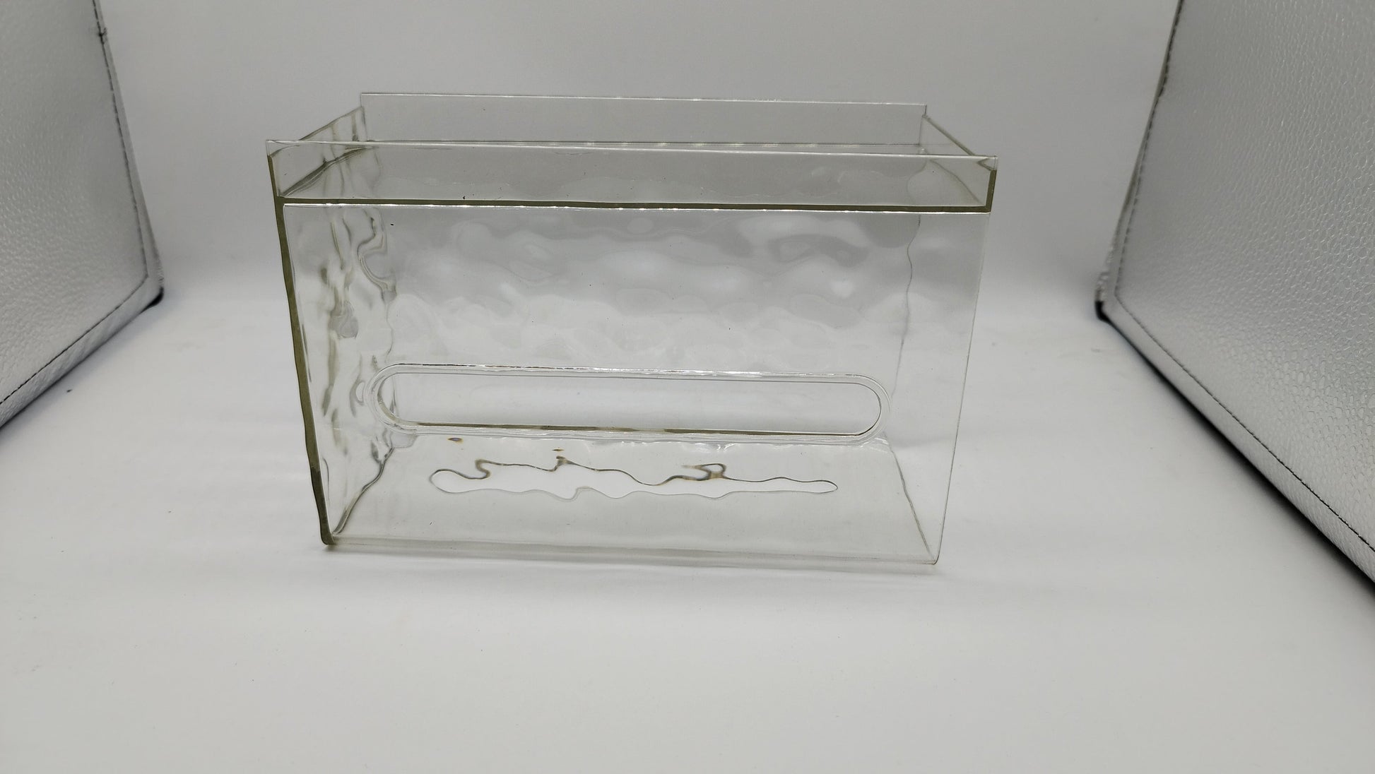 Waf Store Lebanon clear acrylic wall-mounted tissue box with a U-shaped opening for modern bathroom or kitchen decor.