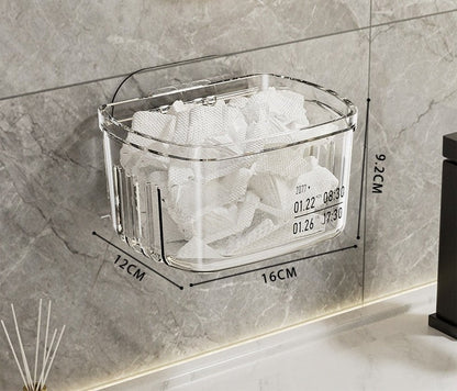 Waf Store Lebanon clear acrylic wall-mounted storage box holding tissues on a grey marble bathroom wall