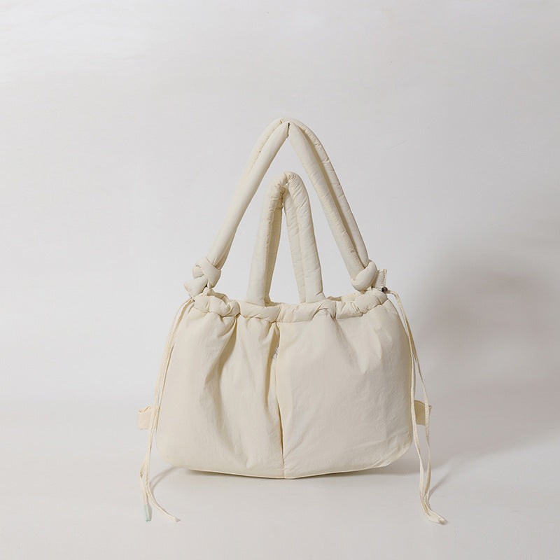 Waf Store Lebanon cream nylon puffer tote bag with knotted handles and drawstring closure on a white background.