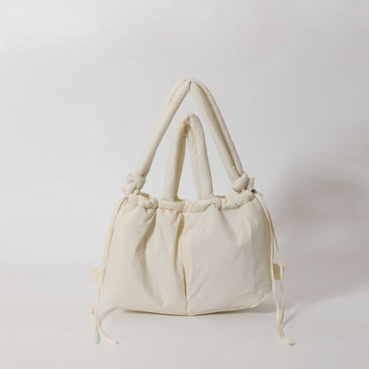 Waf Store Lebanon cream nylon puffer tote bag with knotted handles and drawstring closure on a white background.