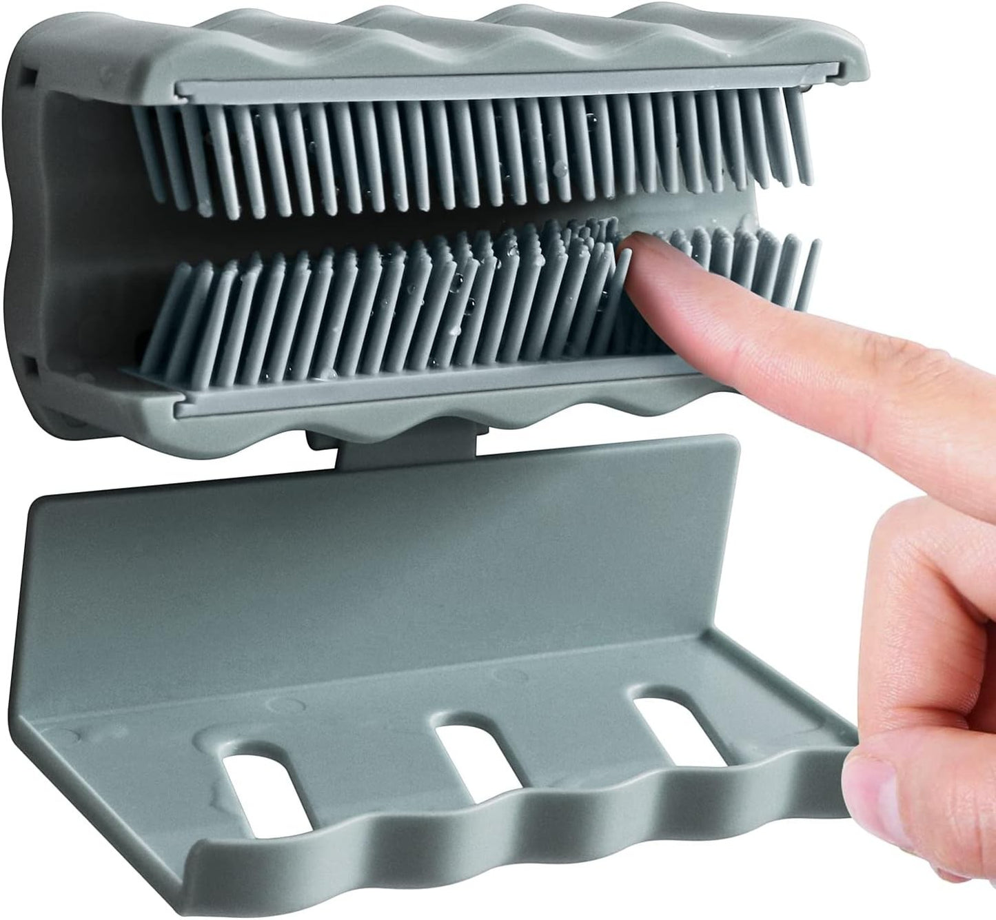 Waf Store Lebanon grey silicone shower hair catcher mounted on a wall with a finger demonstrating how to trap hair