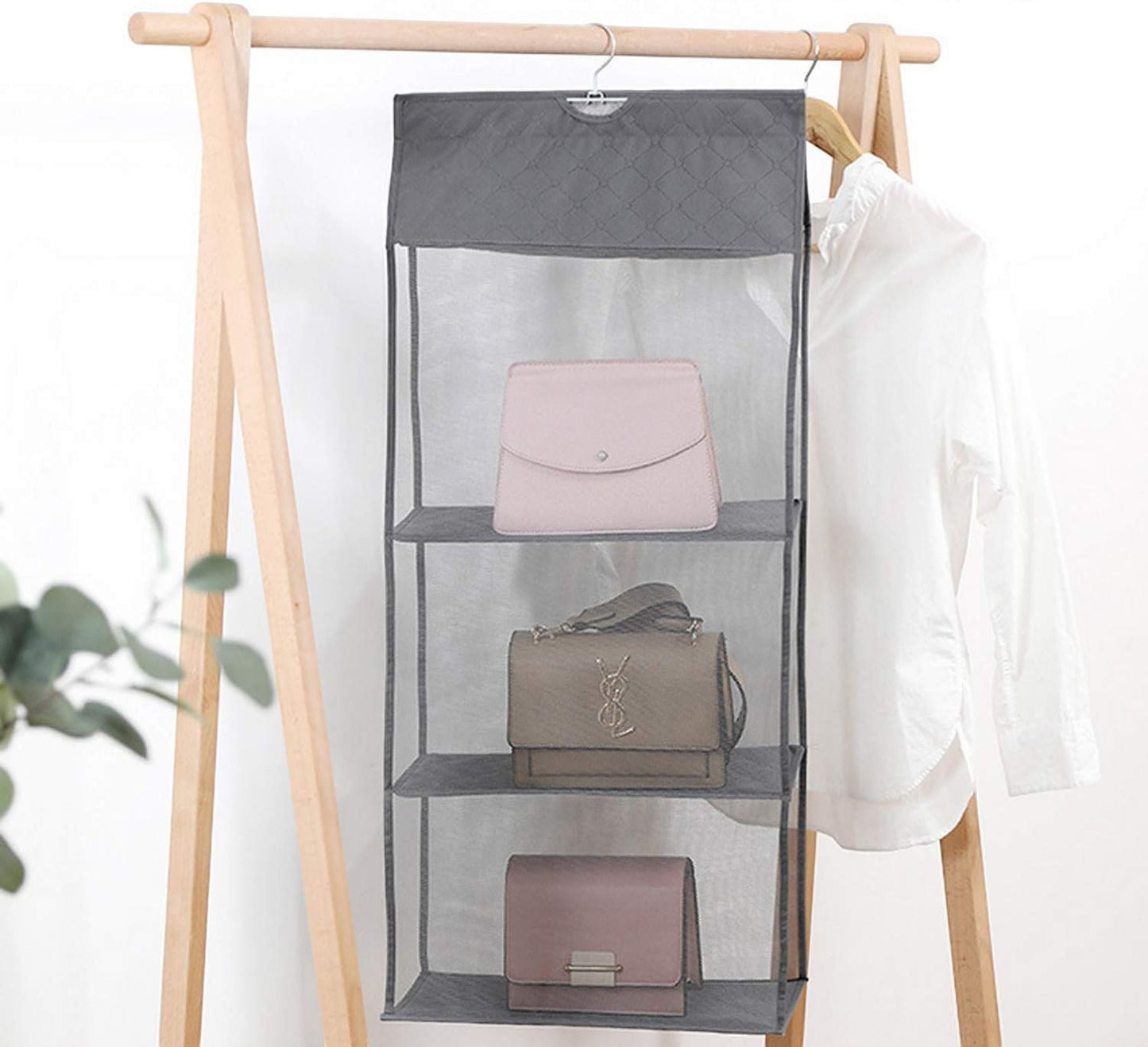 Waf Store Lebanon 4-tier grey hanging handbag organizer made of non-woven fabric and mesh on a wooden clothing rack.