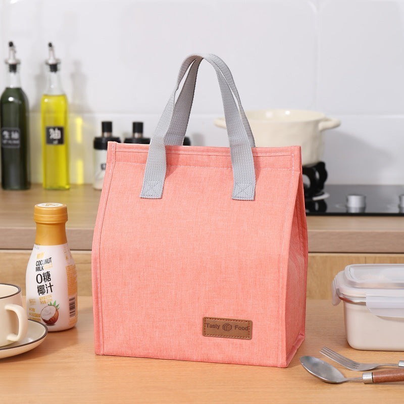 Waf Store Lebanon insulated lunch bag in peach cationic fabric with grey handles and a Tasty Food logo patch.