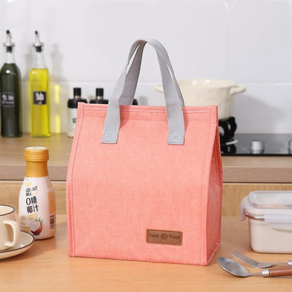 Waf Store Lebanon insulated lunch bag in peach cationic fabric with grey handles and a Tasty Food logo patch.