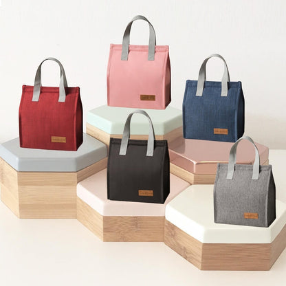 Waf Store Lebanon insulated lunch bags in various colors, made of durable cationic fabric with thermal lining.