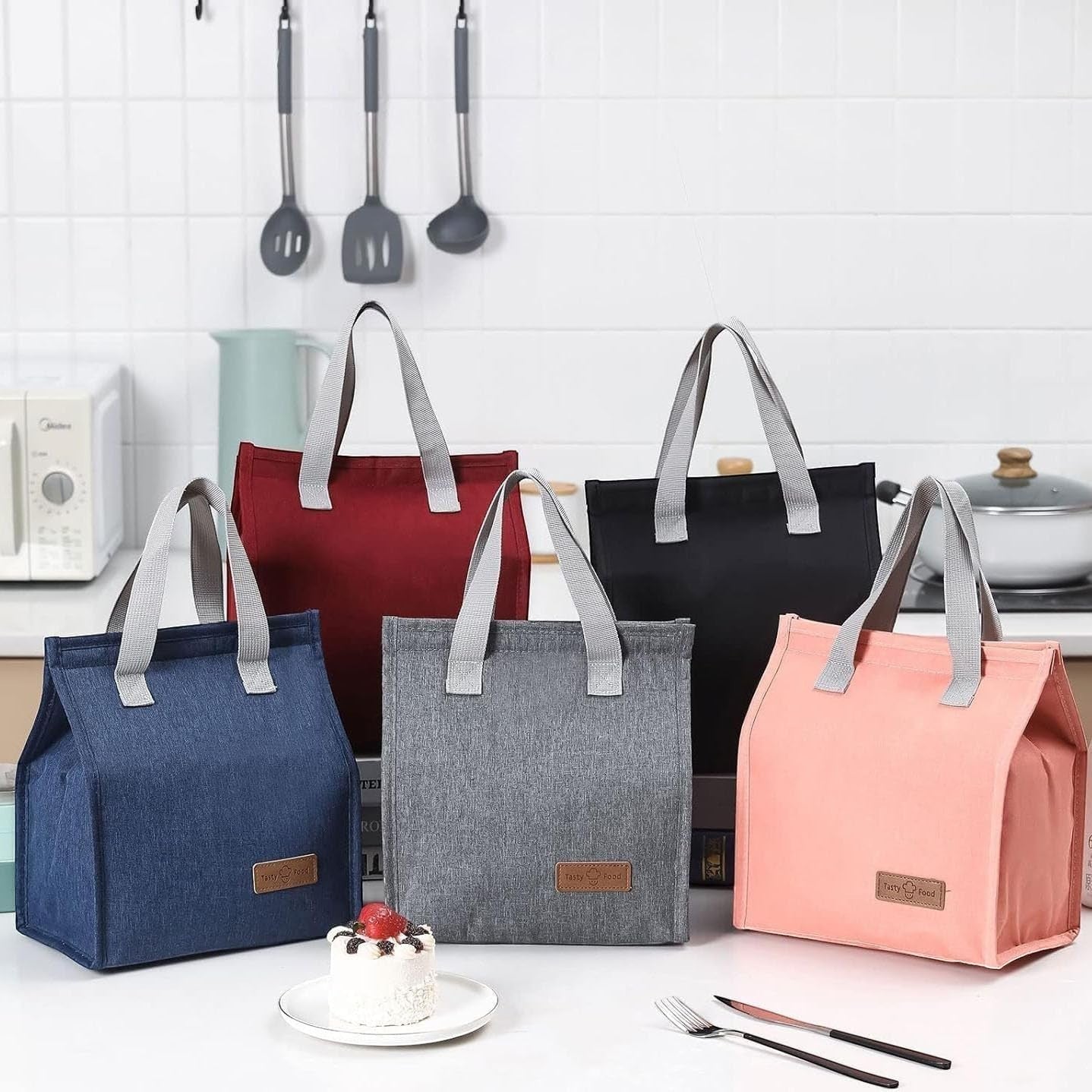 Waf Store Lebanon insulated lunch bags in various colors with cationic fabric, aluminum foil lining, and sturdy handles.