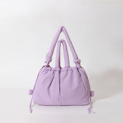 Waf Store Lebanon lavender nylon puffer tote bag with knotted handles and drawstring closure for versatile styling.