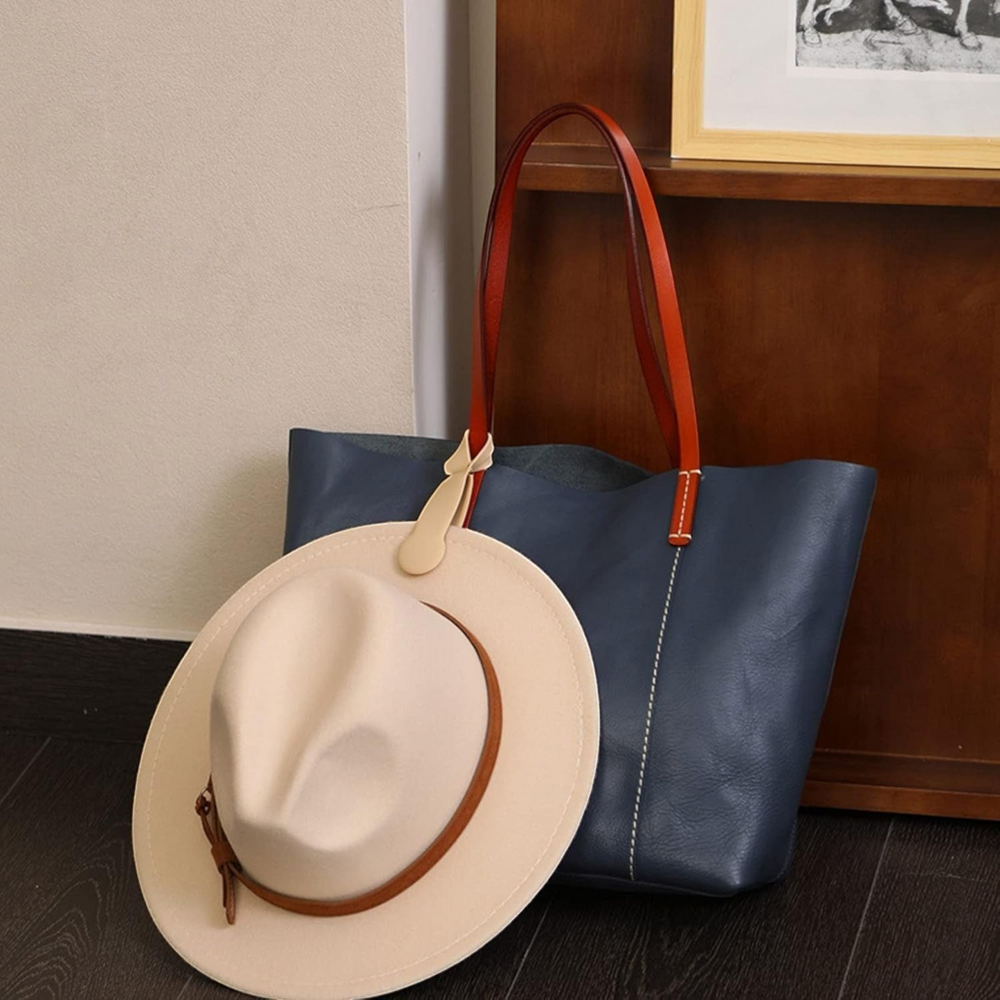 Waf Store Lebanon beige silicone magnetic hat clip attached to a blue leather tote bag holding a fedora hat