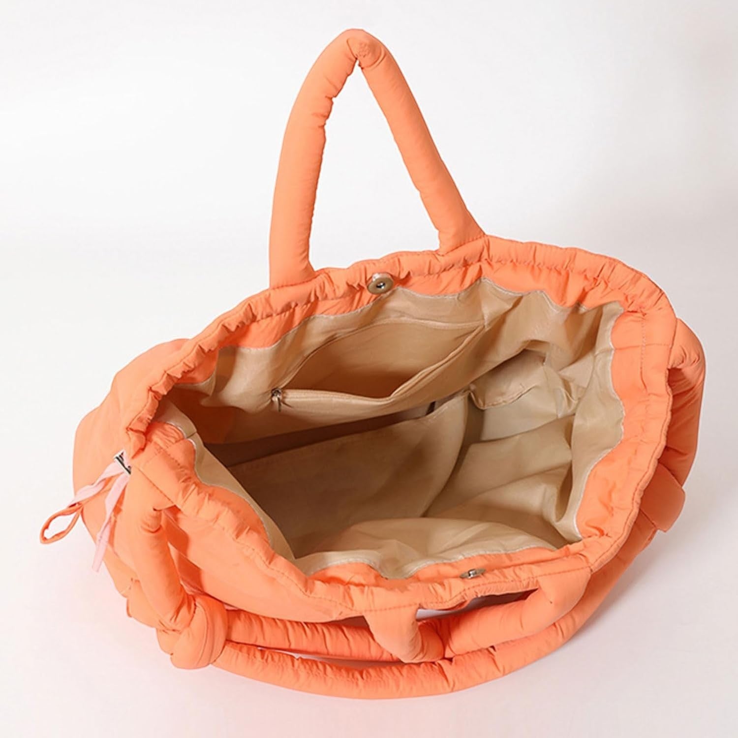 Waf Store Lebanon orange nylon puffer tote bag with quilted design, interior pockets, and convertible straps.